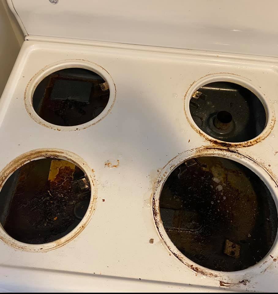 Stove before cleaning - dirty burners and surface